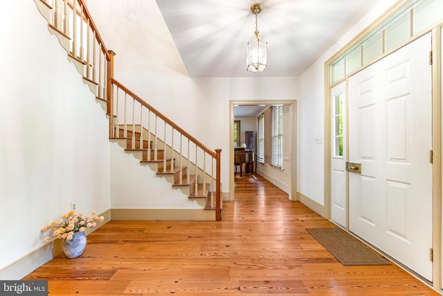 16909 Batchellors Forest Rd, Silver Spring, MD 20906 - foyer featuring stairway, light wood-style floors, and baseboards
