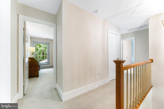 16909 Batchellors Forest Rd, Silver Spring, MD 20906 - hallway with an upstairs landing, carpet floors, and baseboards