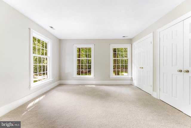 16909 Batchellors Forest Rd, Silver Spring, MD 20906 - unfurnished bedroom with carpet flooring, multiple closets, and baseboards
