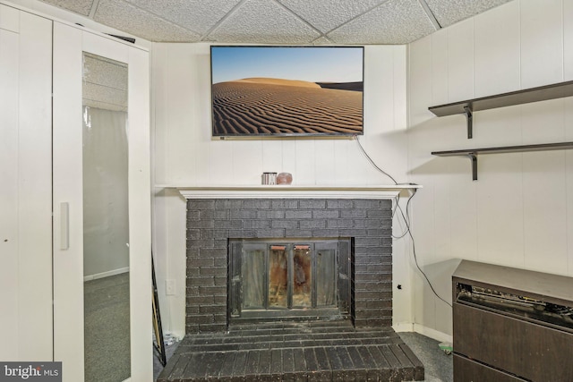 2908 Ruskin Ct, Abingdon, MD 21009 - detailed view of a brick fireplace, baseboards, a drop ceiling, and carpet flooring