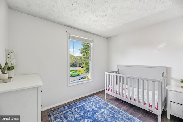 2908 Ruskin Ct, Abingdon, MD 21009 - bedroom featuring wood finished floors, a textured ceiling, and baseboards