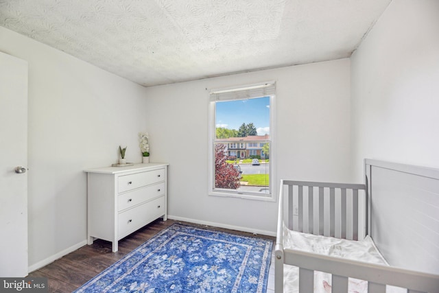 2908 Ruskin Ct, Abingdon, MD 21009 - bedroom featuring dark wood finished floors, baseboards, and a textured ceiling