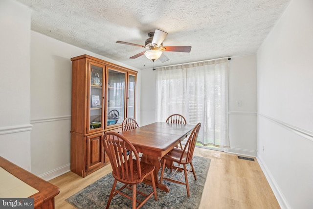 2908 Ruskin Ct, Abingdon, MD 21009 - dining space with light wood finished floors, ceiling fan, baseboards, and a textured ceiling