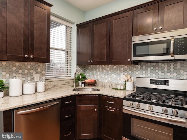628 E Fort Ave, Baltimore, MD 21230 - kitchen with appliances with stainless steel finishes, a sink, and dark brown cabinetry
