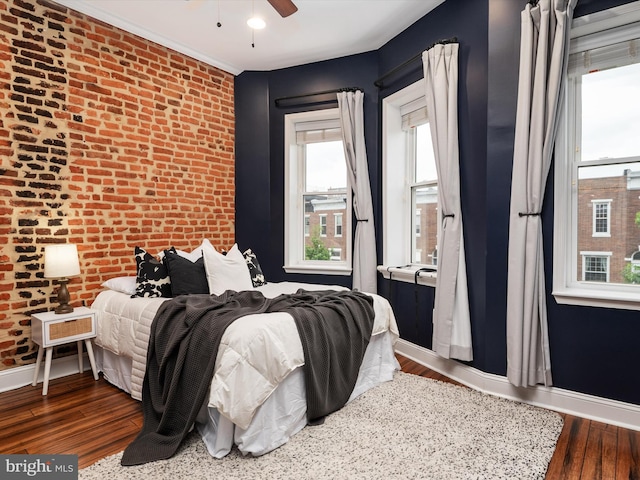 628 E Fort Ave, Baltimore, MD 21230 - bedroom featuring brick wall, wood finished floors, baseboards, and a ceiling fan
