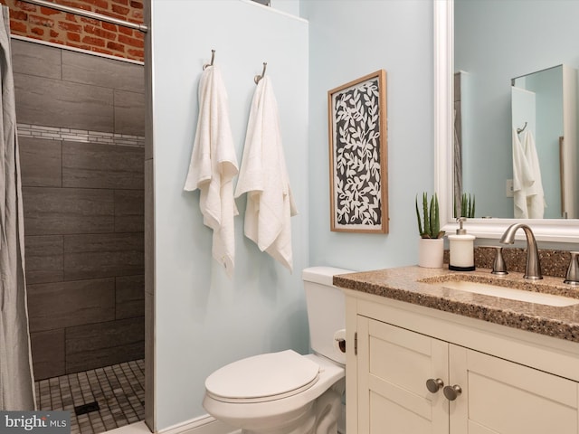 628 E Fort Ave, Baltimore, MD 21230 - bathroom with vanity, tiled shower, and toilet