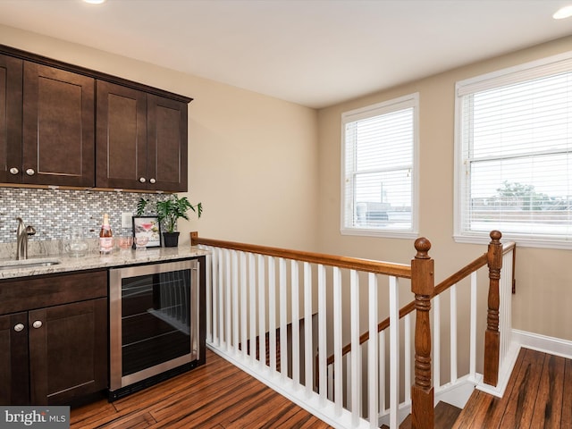 628 E Fort Ave, Baltimore, MD 21230 - indoor bar with beverage cooler, dark wood-type flooring, backsplash, baseboards, and recessed lighting