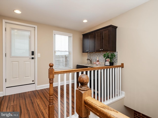 628 E Fort Ave, Baltimore, MD 21230 - foyer entrance with dark wood finished floors, recessed lighting, baseboards, and bar