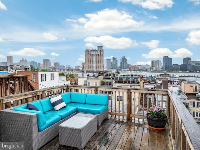 628 E Fort Ave, Baltimore, MD 21230 - wooden terrace with an outdoor living space and a skyline view