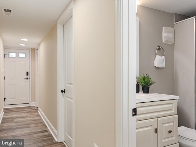 628 E Fort Ave, Baltimore, MD 21230 - hall with light wood-style floors, baseboards, and recessed lighting