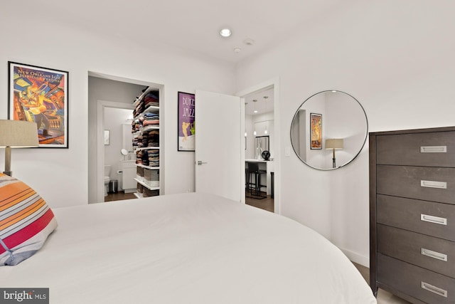 1405 W St NW Unit 203, Washington, DC 20009 - bedroom featuring a walk in closet, ensuite bathroom, and recessed lighting