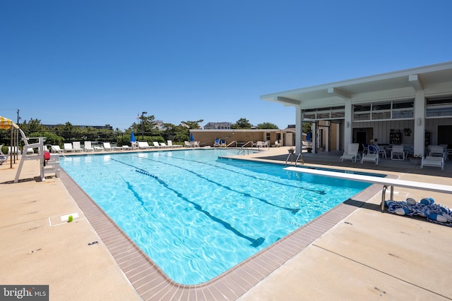 17 Robins Ln, Rehoboth Beach, DE 19971 - community pool with a patio and a diving board