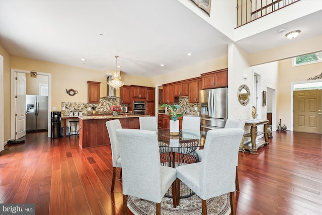 15613 Ancient Oak, North Potomac, MD 20878 - dining room featuring dark wood finished floors, a towering ceiling, and recessed lighting