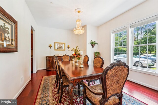 15613 Ancient Oak, North Potomac, MD 20878 - dining room featuring dark wood-style floors, a chandelier, and arched walkways