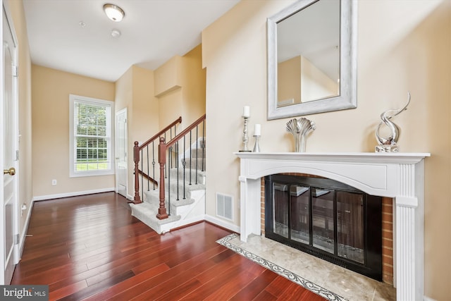 15613 Ancient Oak, North Potomac, MD 20878 - foyer entrance with a fireplace with flush hearth, wood finished floors, and stairway
