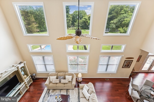 15613 Ancient Oak, North Potomac, MD 20878 - living area with dark wood-type flooring, a high ceiling, and a ceiling fan
