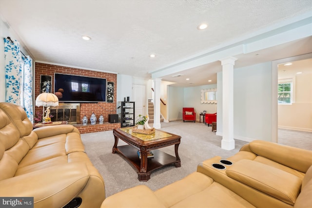 15613 Ancient Oak, North Potomac, MD 20878 - living area featuring ornate columns, light carpet, recessed lighting, a textured ceiling, and brick wall