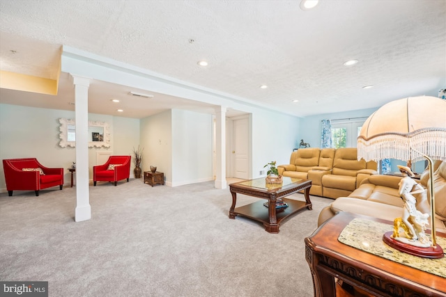 15613 Ancient Oak, North Potomac, MD 20878 - carpeted living area featuring a textured ceiling, recessed lighting, and ornate columns