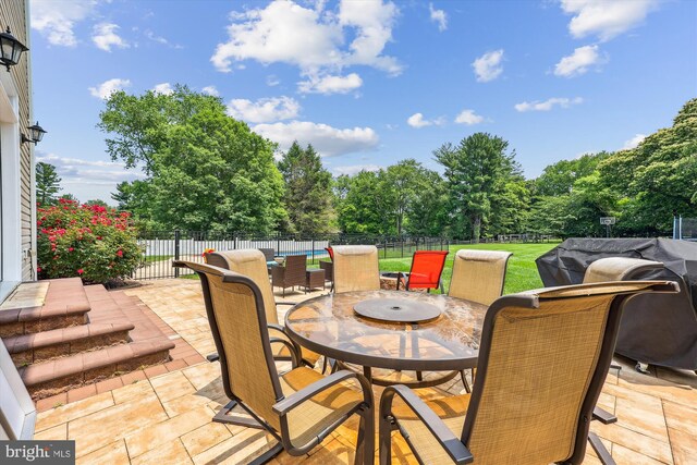 15613 Ancient Oak, North Potomac, MD 20878 - fenced backyard with outdoor dining area, a patio, and view of wooded area