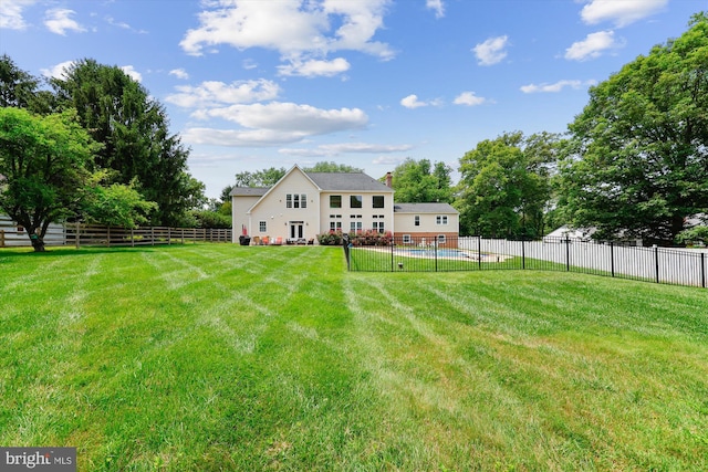 15613 Ancient Oak, North Potomac, MD 20878 - rear view of property featuring a fenced backyard, a patio, and a chimney