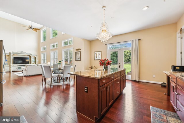 15613 Ancient Oak, North Potomac, MD 20878 - kitchen featuring dark wood-style floors, a chandelier, hanging light fixtures, light stone counters, and recessed lighting