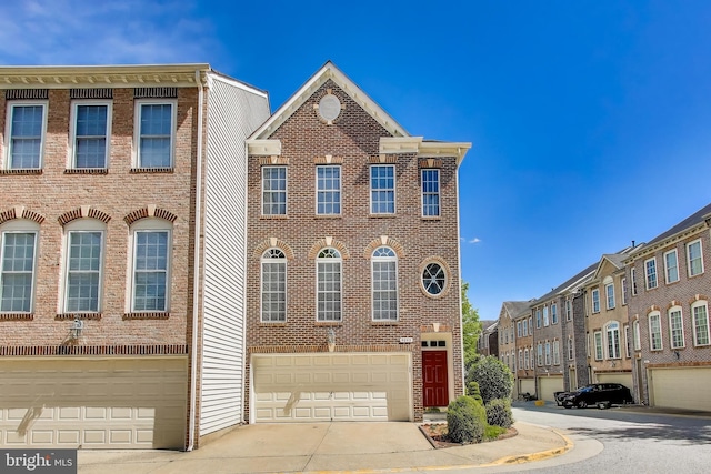 9093 Acheson Ct, Lorton, VA 22079 - view of property with brick siding, a garage, and concrete driveway
