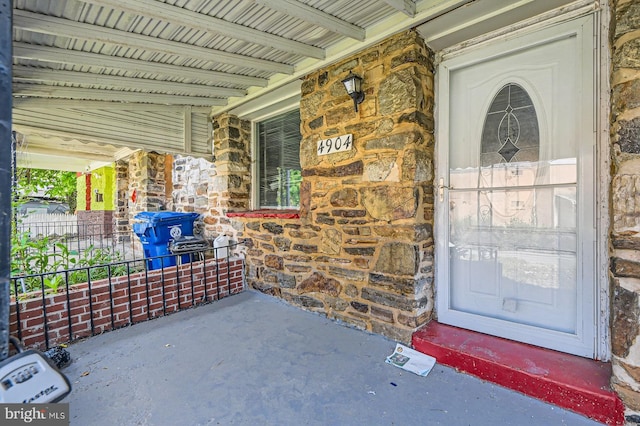 4904 Pembridge Ave, Baltimore, MD 21215 - property entrance with stone siding and a porch