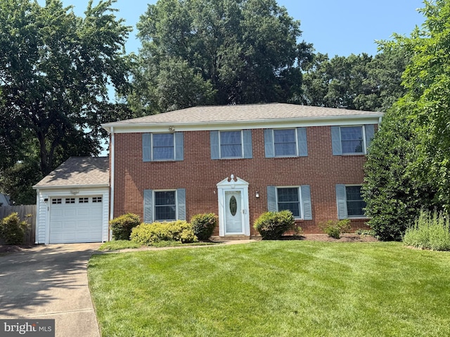 1213 Terrylynn Ct, Herndon, VA 20170 - colonial house with concrete driveway, a front yard, a garage, and brick siding