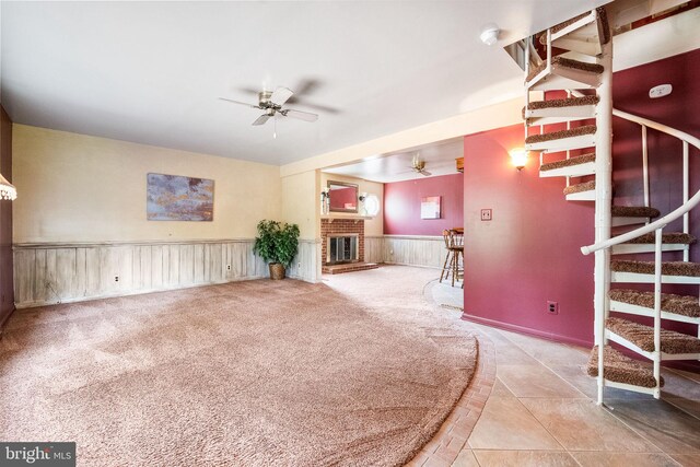 1213 Terrylynn Ct, Herndon, VA 20170 - unfurnished living room featuring ceiling fan, stairs, a wainscoted wall, and a fireplace