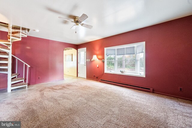 1213 Terrylynn Ct, Herndon, VA 20170 - unfurnished living room featuring a baseboard heating unit, ceiling fan, stairway, carpet flooring, and baseboards
