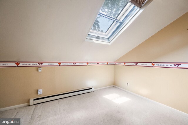 1213 Terrylynn Ct, Herndon, VA 20170 - carpeted empty room with baseboard heating, a skylight, baseboards, and vaulted ceiling