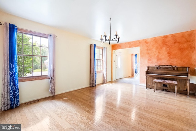 1213 Terrylynn Ct, Herndon, VA 20170 - unfurnished living room with a chandelier, wood finished floors, and baseboards