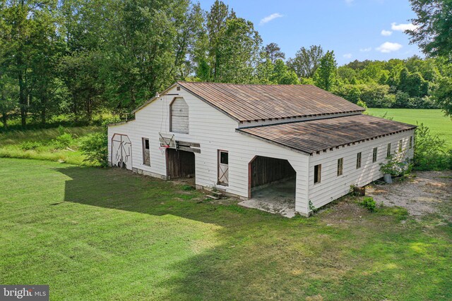 1838 Muddy Gut Rd, Dunnsville, VA 22454 - view of barn with a lawn
