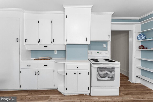 1838 Muddy Gut Rd, Dunnsville, VA 22454 - kitchen with white range with electric cooktop, ornamental molding, light countertops, white cabinets, and light wood-style floors