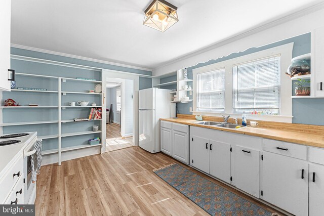1838 Muddy Gut Rd, Dunnsville, VA 22454 - kitchen with open shelves, crown molding, white appliances, a sink, and light wood finished floors