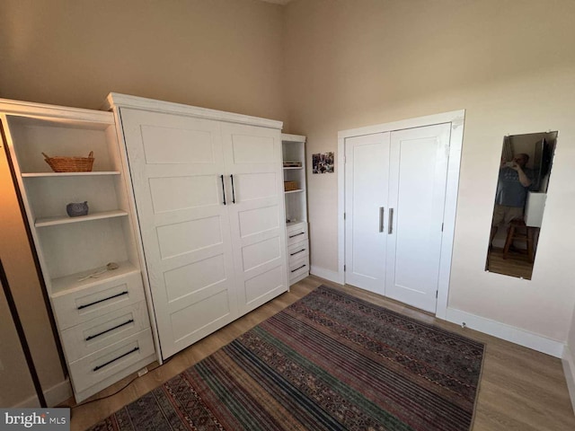 911 Harbour House Rd Unit 911, Bethany Beach, DE 19930 - unfurnished bedroom featuring light wood-type flooring and baseboards