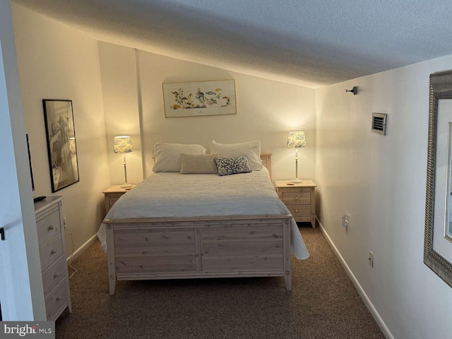 911 Harbour House Rd Unit 911, Bethany Beach, DE 19930 - bedroom with dark colored carpet, a textured ceiling, and baseboards