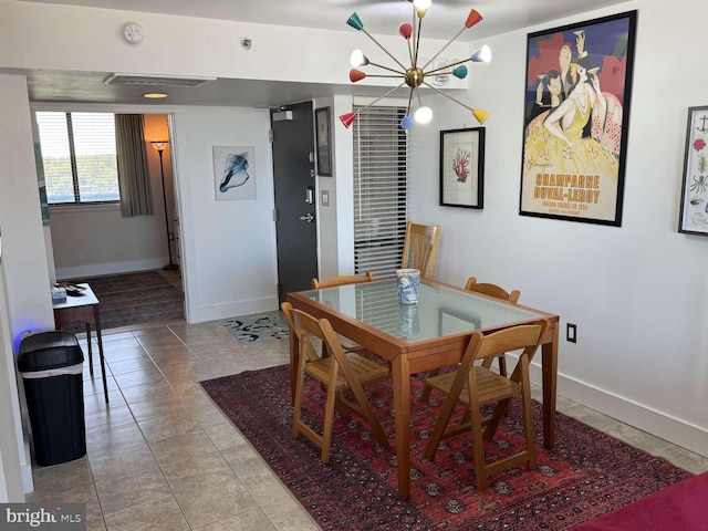 911 Harbour House Rd Unit 911, Bethany Beach, DE 19930 - tiled dining area with baseboards and a chandelier