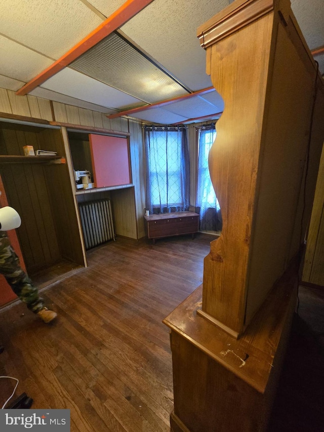 233 S 58th St, Philadelphia, PA 19139 - unfurnished living room with wood finished floors and wooden walls