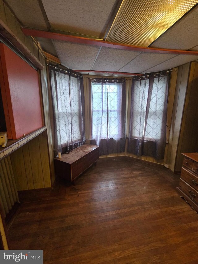 233 S 58th St, Philadelphia, PA 19139 - spare room featuring dark wood-style floors and wooden walls