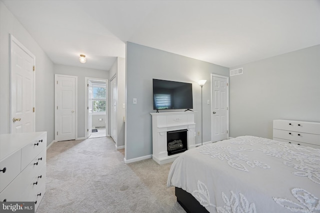 7 Quail Ct, Wilmington, DE 19810 - bedroom with light carpet, baseboards, and a fireplace with raised hearth