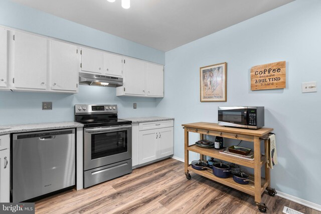 18 Huxley Cir, Abingdon, MD 21009 - kitchen with appliances with stainless steel finishes, under cabinet range hood, light wood finished floors, and white cabinetry