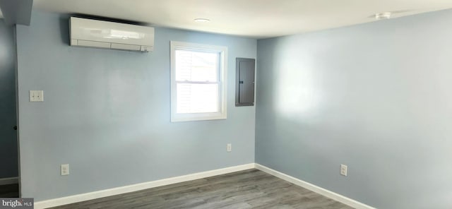 28488 Nanticoke Ave Unit 6842, Millsboro, DE 19966 - spare room with a wall mounted air conditioner, electric panel, baseboards, and wood finished floors