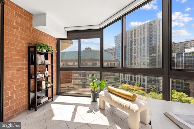 1001 N Randolph St Unit 910, Arlington, VA 22201 - sunroom featuring expansive windows, tile patterned floors, brick wall, and a city view