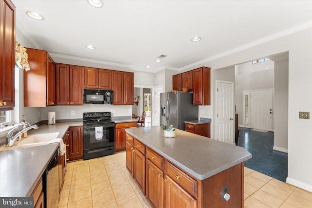 kitchen featuring black appliances, light tile patterned floors, a center island, recessed lighting, and a sink