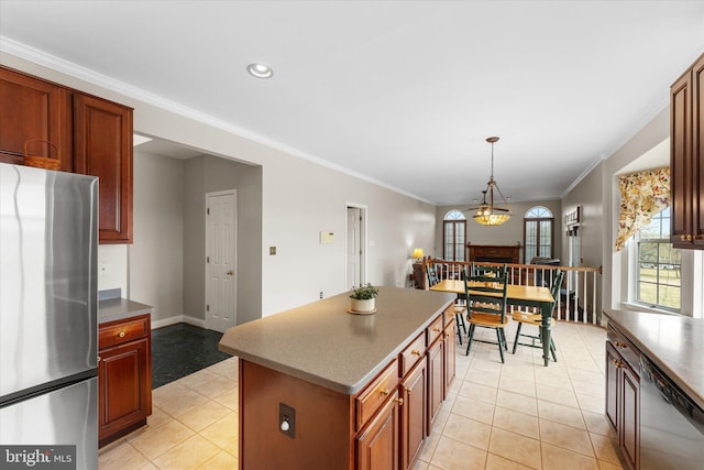 kitchen featuring stainless steel appliances, ornamental molding, light tile patterned flooring, decorative light fixtures, and recessed lighting