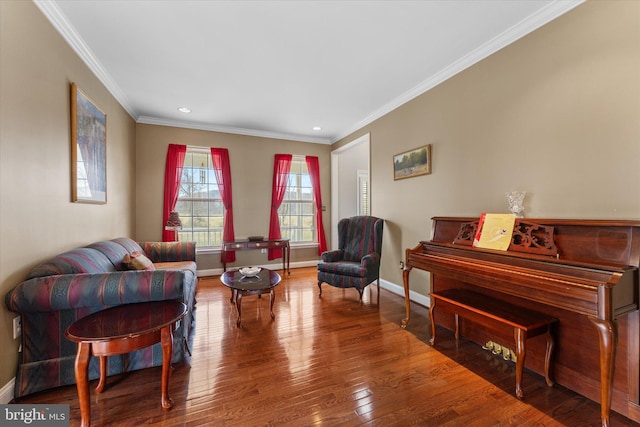 living room with wood finished floors, crown molding, recessed lighting, and baseboards
