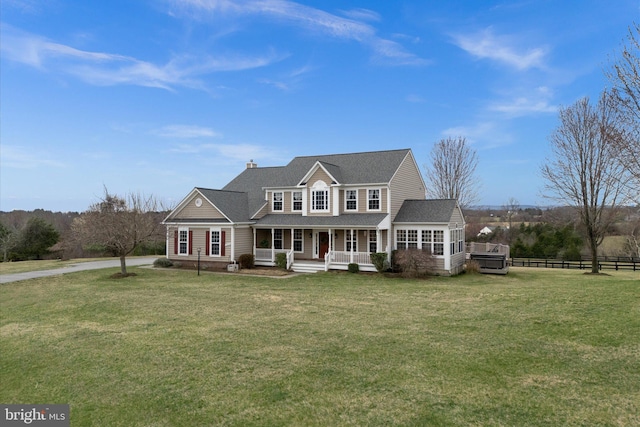 view of front of house with covered porch, a chimney, and a shingled roof