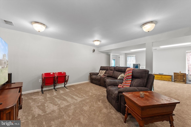 living room with carpet and baseboards