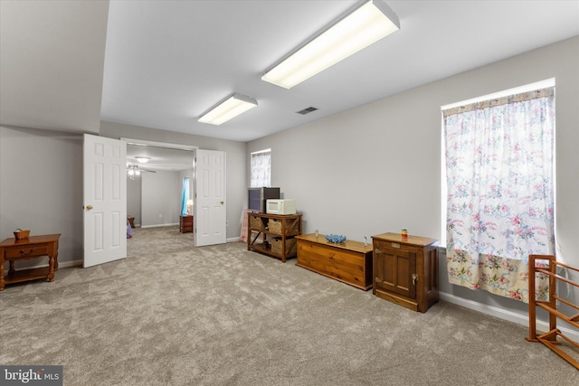carpeted bedroom featuring baseboards